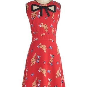 Trollied Dolly. Red floral. Size L